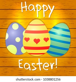 Set of multi-colored Easter eggs on a brown wood texture background. Happy easter.