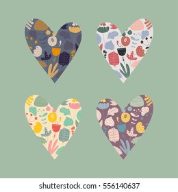 Set of multicolored hearts filled with hand draw flowers and plants. Valentine's Day design elements.