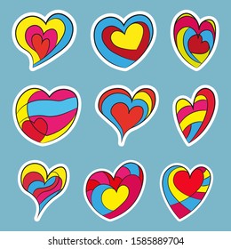 Set of multi-colored hearts. Vector drawing. Isolated object on a blue background. Isolate. The badges.