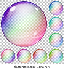 Set of multicolored transparent glass spheres on a plaid background