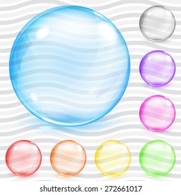 Set of multicolored transparent glass spheres with glares and shadows