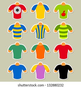 Set of multicolored t-shirts on a light background. T-shirts in the form of stickers.