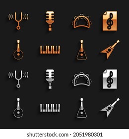 Set Music synthesizer, Treble clef, Electric bass guitar, Guitar, Banjo, Tambourine, Musical tuning fork and Microphone icon. Vector