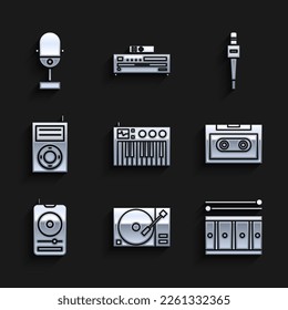 Set Music synthesizer, Vinyl player with a vinyl disk, Drum drum sticks, Retro audio cassette tape, MP3, Microphone and  icon. Vector