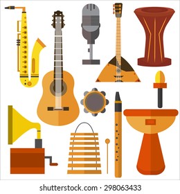 Set of musical instruments on a white background. Multi Colored icons isolated guitar, trumpet, gramophone, microphone in flat style for design. Vector illustration