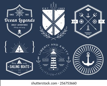 Set of nautical logos, badges and labels on blackboard