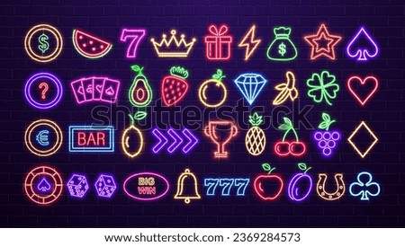 A set of neon, bright glowing shiny casino and poker icons in the colors blue, purple, yellow and pink on a brick wall background. Fruits, suits for cards, crown, coins, chips and dice.