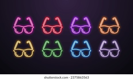 A set of neon bright luminous glasses in different colors on a dark background.