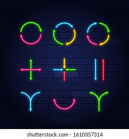 Set of neon frame star arrows pointers signs light electric banners glowing on black brick wall background, vector illustration