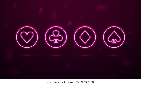 A set of neon symbols of playing cards in bright circles for the casino.
