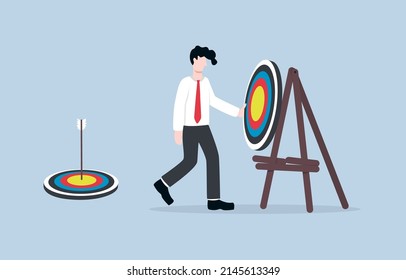 Set new business goal or determine new purpose to be successful, next target in career development or achievement concept. Ambitious businessman installing latest archery target.