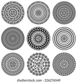 Set of nine 9 ethnic monochromatic round design elements isolated on white background. Can be used for invitation, menu, card design, for pillow design, banners, signs and others. Vector illustration