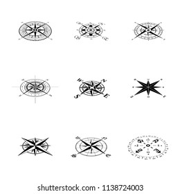 Set of nine black windrose compass silhouettes in perspective isolated on white background