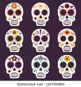 Set of nine colorful and decorative Mexican sugar skulls for Day of the Dead