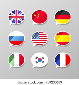 Set of nine colorful speech bubbles with flags, different language concept