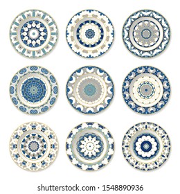 Set of nine decorative plates with a circular colored pattern, top view. White background. Vector illustration.