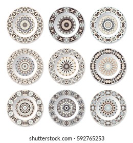 Set of nine decorative plates with a circular colored pattern, top view. White background. Vector illustration.