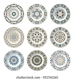 Set of nine decorative plates with a circular colored pattern, top view. White background. Vector illustration.