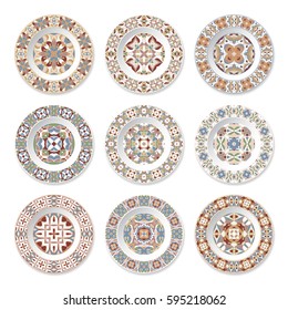 Set of nine decorative plates with a circular colored pattern, top view. White background. Vector illustration.