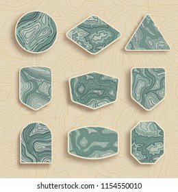 Set of nine empty topographic map travel emblems. Outdoor adventure emblems, badges and logo patches. Map pattern with mountain texture and grid