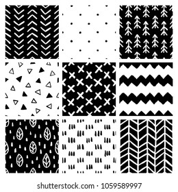 Set of nine hand drawn black and white scandinavian style trendy seamless patterns. Stripes, lines, crosses. Abstract monochrome design elements for different design needs. Vector illustration.