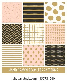 A set of nine hand drawn seamless patterns in black, gold, pastel pink and cream. Stripes, polka dots, triangles, chevron, round brush stroke patterns.