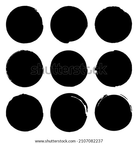 Set of nine round prints. Grunge texture elements for design. Circle with worn effect. Vector isolated objects on a white background. 