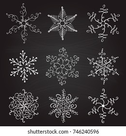 set of nine vintage vector illustration christmas snowflakes on chalkboard background. flourish calligraphic handmade