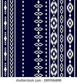 Set of Nordic borders. Vertical ornaments with paisleys and geometric elements. Retro textile collection. White on dark blue background.