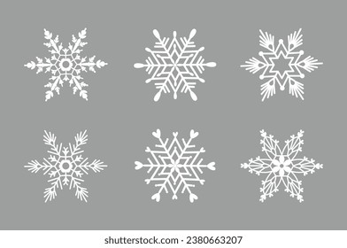 Juego de copos de nieve nórdicos sobre fondo gris. Ilustración vectorial de copos de nieve de invierno de estilo plano. Juego de invierno de copos de nieve blancos.