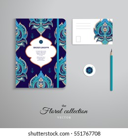 Set of notebook, pencil, tag and card. Orient paisley flowers pattern and dark backdrop