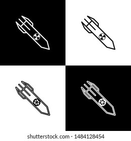 Set Nuclear rocket icon isolated on black and white background. Rocket bomb flies down.  Vector Illustration