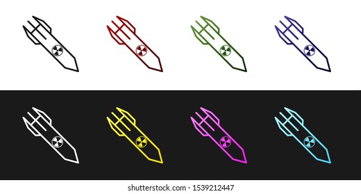 Set Nuclear rocket icon isolated on black and white background. Rocket bomb flies down.  Vector Illustration