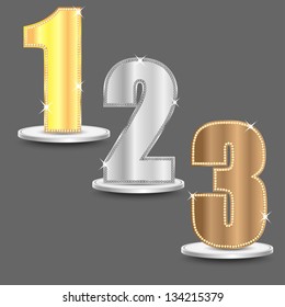 set of numbers of gold  silver and bronze color decorated by brilliant stones