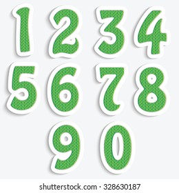 The set of numbers with a green knit pattern.Numbers isolated on white background
