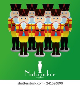 a set of nutcracker soldiers on a green background