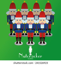 a set of nutcracker soldiers on a green background