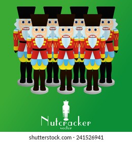 a set of nutcracker soldiers on a green background