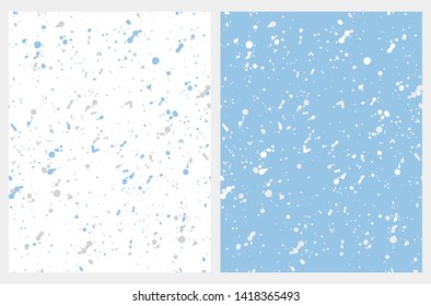 Set o 2 Abstract Geometric Vector Patterns. Irregular Handmade Gray, White, Blue Splashed Dots on a Blue and White Backgrounds. Simple Creative Repeatable Design.Infantile Style Expressive Painting.