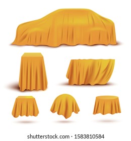 Set of objects and gifts covered with realistic yellow covers for curtains. Car, stands and boxes covered with yellow silk or satin fabric, isolated realistic vector illustration.