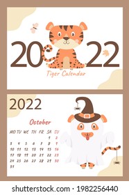 Set - October 2022 calendar and cover. Cute ghost tiger in a hat with spiders, Halloween holiday. horizontal A4 template. Week starts on Monday. Year of the Tiger in Chinese or orienta