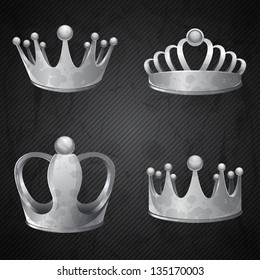 Set of old silver crowns isolated.
