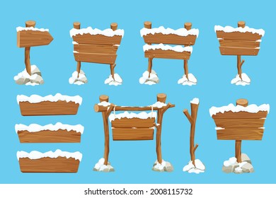 Set old wooden blank, signboard with snow in cartoon style.Empty frames, direction plank isolated on blue background. Season decoration