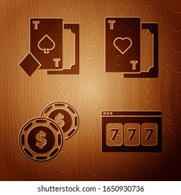 Set Online slot machine with lucky sevens jackpot, Playing card with spades, Casino chip with dollar and Playing card with heart on wooden background. Vector