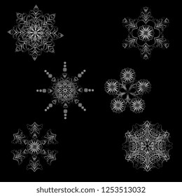 set of openwork snowflakes of silver metallic color. Element for Christmas design