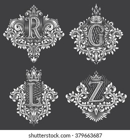 Set of ornamental monogram in coats of arms form. White floral decorations on black. Isolated tattoos in vintage baroque style.