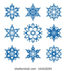 Set of ornamental vector snowflakes on white