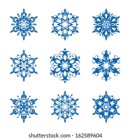 Set of ornamental vector snowflakes on white