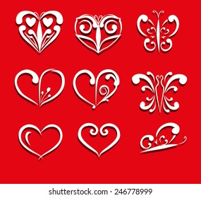 Set of ornate hearts and butterflies on a red background. Stylized.