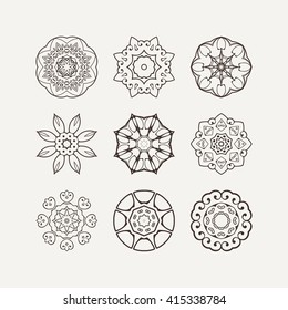 Set of ornate vector mandala symbols. Mehndi lace tattoo. Oriental weave. The circular pattern.